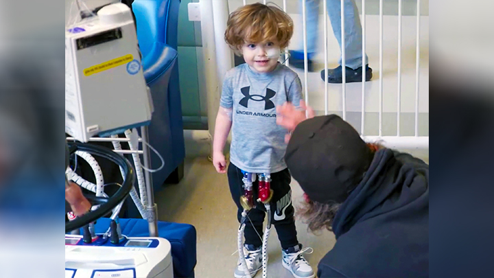 Three-year-old Greyson Eackett has been in the Stollery Children’s Hospital for more than eight months. As he awaits a heart transplant, he recently started using his new ventricular assist device (VAD) driver to help pump his blood, with a longer battery life that’s opening up a world of possibilities for more activities with his family.
