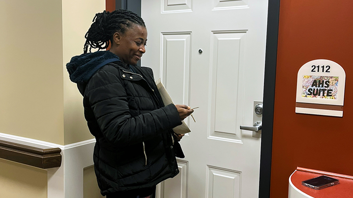 After a long journey, Chinyere Mbadinuju is happy to unlock the door to her temporary apartment for the first time.