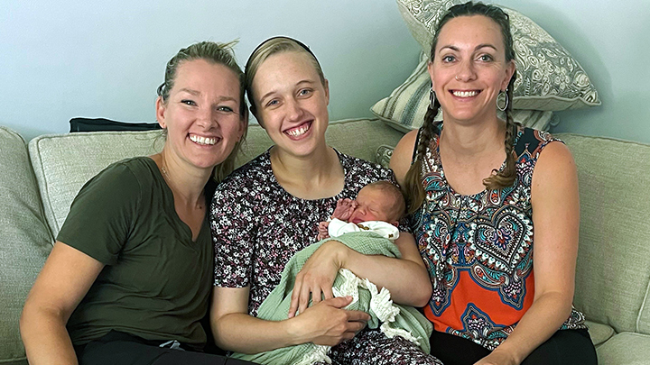 Yolanda Fehr holds her baby boy and shares smiles with Registered Midwives Stacy Peleskey, left, and Leesha Mafuru, who helped her deliver the first baby born using new water-immersion equipment at Taber Health Centre.