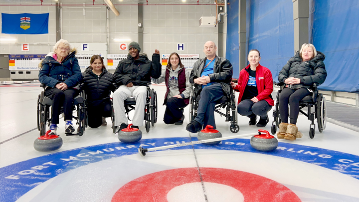 Willow Square residents and staff — Effie Pope, left, recreation therapist Rose Isaac, Farah Abdi, recreation therapy assistant Hailey Kanak, Dave Barrett, recreation therapist Tiffany Butler and Emily Boser — gather at a recent outing of wheelchair curling.