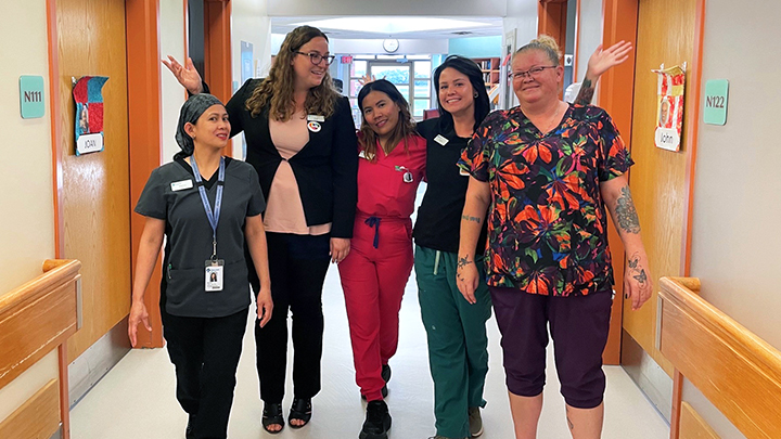 Patient care manager Kathleen Leslie, second from left, spends time with a few of Willow Creek Continuing Care Centre's dedicated health care aides, from left, Marivic Masirag, Jevylyn Salenga, Amber Driedger and Helen Lambert.