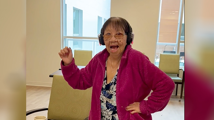 Resident Annie Mercredi dances to music while wearing her Sound Off headphones at Willow Square Continuing Care Centre.