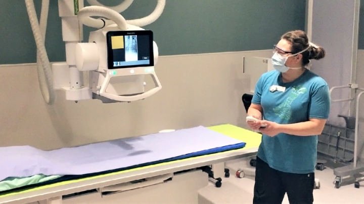 Rebecca Walter, combined lab and X-ray technologist, demonstrates the new digital radiographic X-ray unit at the Sylvan Lake Advanced Ambulatory Care Service. The equipment was made possible through a donation from local residents Stephen and Jacqueline Wuori to the Sylvan Lake and Area Urgent Care Committee.